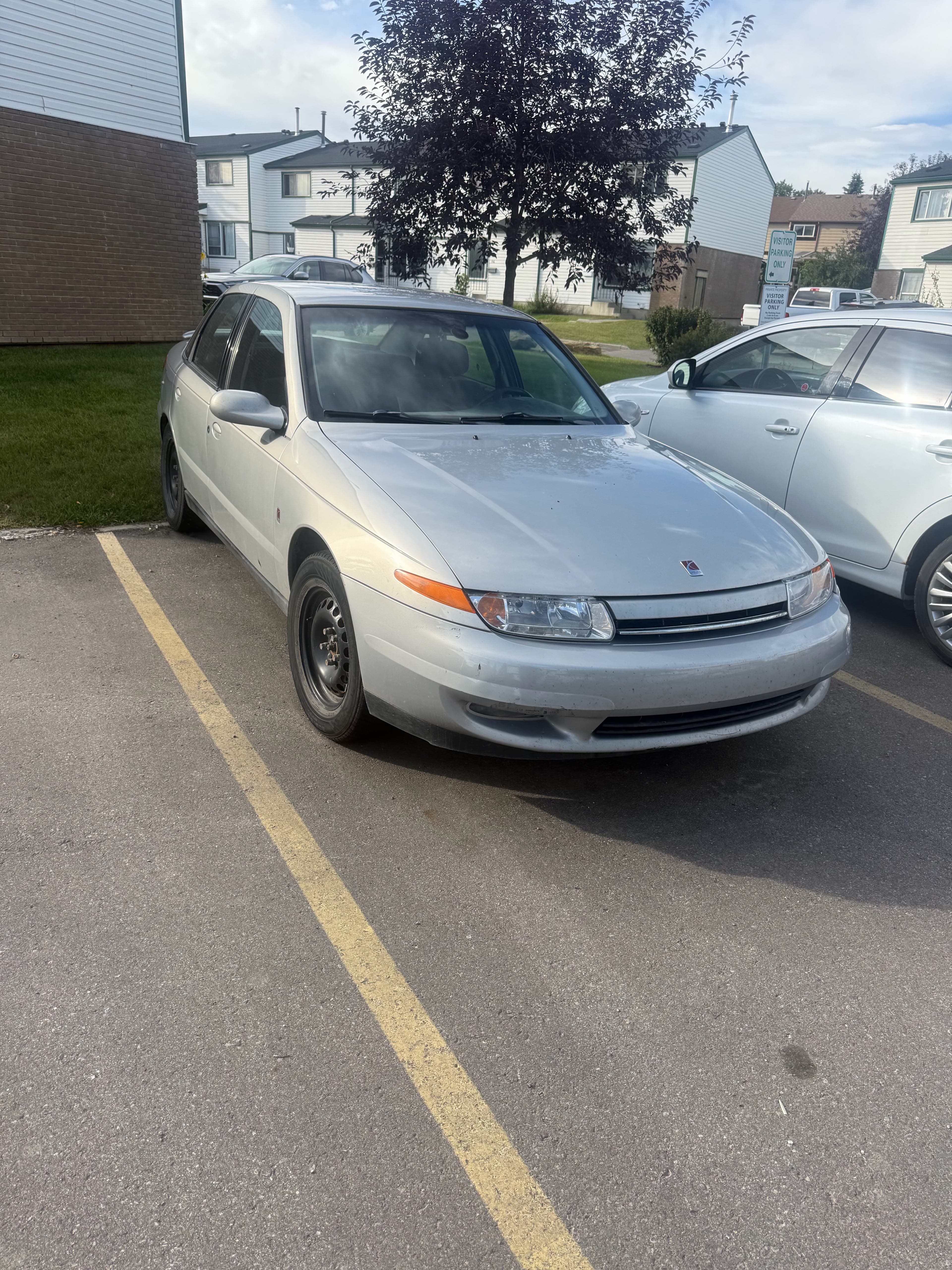 Silver Saturn ready for cash vehicle pickup in Calgary